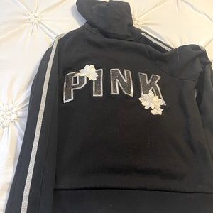 Pink zip up jacket in color black with beautiful details. Size Medium